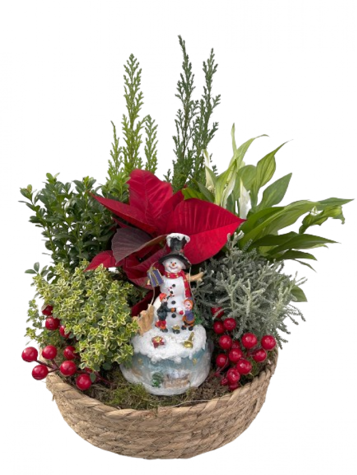 cesta decorada de flores de pascua con plantas variadas